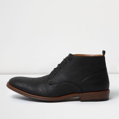 Black perforated chukka boots